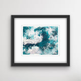 An abstract acrylic painting on paper in  a black frame.The painting is of a wave, in dark teal and white. There is collaged text in sections of the painting.