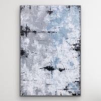 This is a large rectangular abstract painting hanging vertically.  It is highly textured in grey/blue,  sandy taupe, white and black.