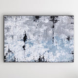 This is a large rectangular abstract painting hanging horizontally. It is highly textured in grey/blue, sandy taupe, white and black.