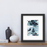 An abstract acrylic painting in a white mat,and framed in a modern black frame. The colours are teal, burnt umber and white.The painting is sitting on a shelf beside two vases and some books.